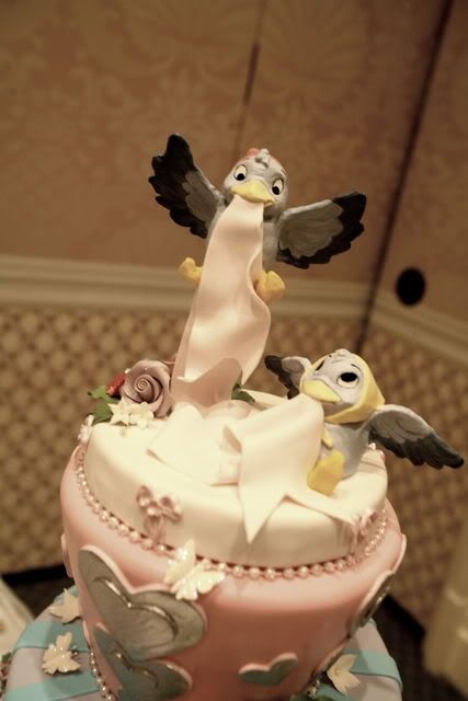 The cake topper is made of chocolate and was made to look like a WDCC figure